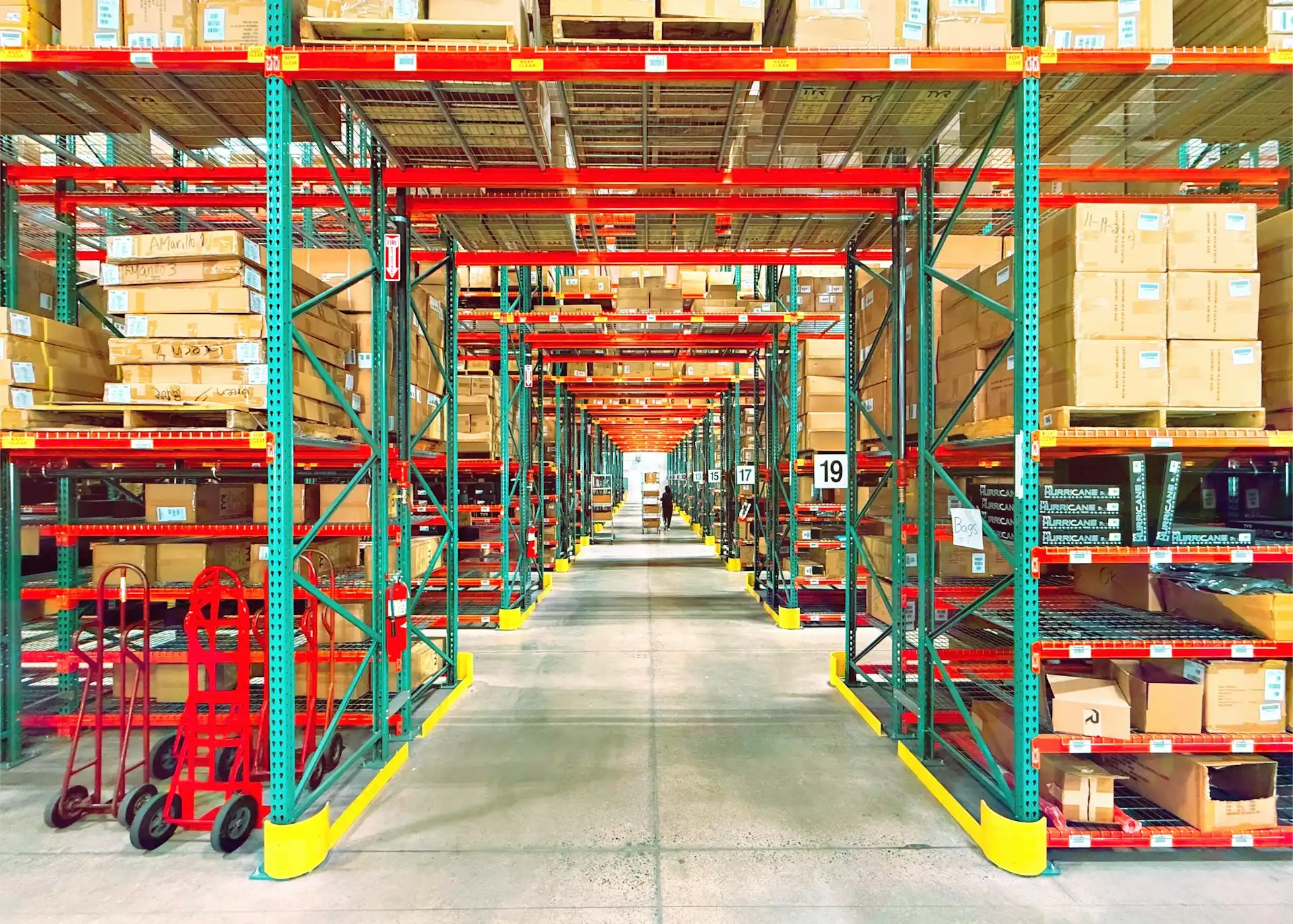 A warehouse is filled with shelves and boxes.